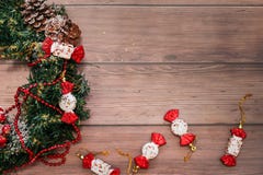 Flat lay of Christmas wreath with bumps and red decor on wooden table. Holidays christmas and new year background stock photography Flat lay of Christmas wreath with bumps and red decor on wooden table. Holidays christmas and new year background stock photography