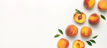 Flat Lay Composition With Peaches. Ripe Juicy Peaches With Green Leaves On White Background. Flat Lay, Top View, Copy Space. Fresh Stock Image