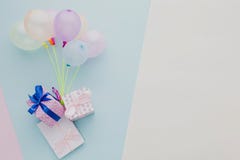 flat lay frame with colorful balloons gifts. High quality photo