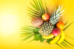 Flat Lay Of Various Tropical Fruits On Palm Leaves. Pineapple, M Stock Photography
