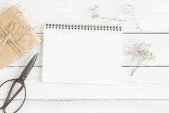 Flat lay photo of blank white notebook on wood table stock image Flat lay photo of blank white notebook on wood table stock image