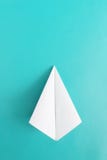 Flat lay of white paper plane on pastel blue color background stock photo Flat lay of white paper plane on pastel blue color background stock photo