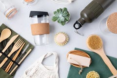 Zero waste kit. Set of eco friendly bamboo cutlery, mesh cotton bag, reusable coffee tumbler, brushes, bar soap and water bottle.