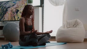 Flexible Black Woman Practicing Sport during Yoga Morning Workout