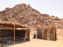 A flimsy, dilapidated decrepit, fragile, fragile poor dwelling, a Bedouin building made of straw, twigs in a sandy hot desert in t stock images A flimsy, dilapidated decrepit, fragile, fragile poor dwelling, a Bedouin building made of straw, twigs in a sandy hot desert in t stock images
