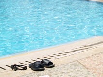 Flip-flops At The Pool Royalty Free Stock Photos