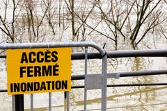 Flooding Access closed sign France. How to get around in Paris by public transport? Flooded banks and the swollen Seine river. France on alert after days of royalty free stock photography Flooding Access closed sign France. How to get around in Paris by public transport? Flooded banks and the swollen Seine river. France on alert after days of royalty free stock photography