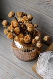 Floral composition of pink pressed roses in a bronze vase standing on a wooden board. Still life floral composition on a table. Is Royalty Free Stock Image Floral composition of pink pressed roses in a bronze vase standing on a wooden board. Still life floral composition on a table. Is Royalty Free Stock Image