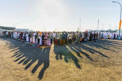 FLORES/INDONESIA-JULY 28 2014: Muslims pray to celebrating Eid al-Fitr which marks the end of the month of Ramadan at the harbour stock photos FLORES/INDONESIA-JULY 28 2014: Muslims pray to celebrating Eid al-Fitr which marks the end of the month of Ramadan at the harbour stock photos