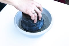 Flower pot upside down in a dish full of water royalty free stock images Flower pot upside down in a dish full of water royalty free stock images