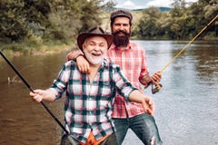 Fly fishing for trout. Fishing. Fisherman fishing with spinning reel. Man fishing. Fly fishing in the pristine stock photo Fly fishing for trout. Fishing. Fisherman fishing with spinning reel. Man fishing. Fly fishing in the pristine stock photo
