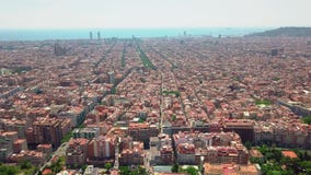 Flying over Barcelona at sunset, Spain. Streets and houses in warm light of evening sun stock video footage Flying over Barcelona at sunset, Spain. Streets and houses in warm light of evening sun stock video footage