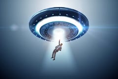 The flying saucer abducting young businessman stock photos The flying saucer abducting young businessman stock photos
