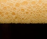 Foam From Dark Beer With Bubbles Stock Photography