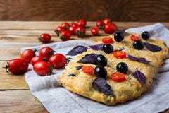 image photo : Focaccia with olive, cherry tomato and basil leaves