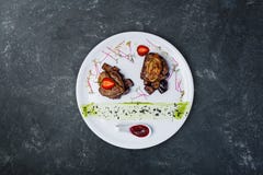 Foie Gras On Medallions Of Veal With Sweet Eggplants. Royalty Free Stock Photos Foie Gras On Medallions Of Veal With Sweet Eggplants. Royalty Free Stock Photos