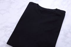 Folded Black Tshirt On Wooden Background Stock Photo - Image of ...