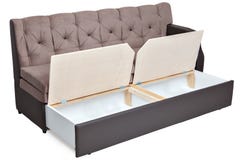 Folding light brown fabric sofa bed with storage. stock photography Folding light brown fabric sofa bed with storage. stock photography
