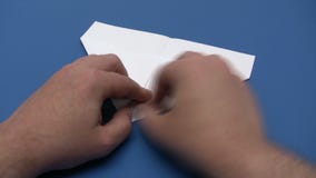 Folding a Paper Plane - Time Lapse
