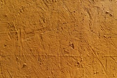 Fond abstrait brouill? La texture d'une surface approximative concr?te peinte avec la couleur orange de fissures et de trous photo stock Fond abstrait brouill? La texture d'une surface approximative concr?te peinte avec la couleur orange de fissures et de trous photo stock