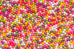 Fond coloré des dragées douces multicolores de sucrerie Texture décorative de vacances de disperser autour des bonbons de chocola photos stock Fond coloré des dragées douces multicolores de sucrerie Texture décorative de vacances de disperser autour des bonbons de chocola photos stock