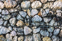 Fond de mur en pierre et fil de maille image stock Fond de mur en pierre et fil de maille image stock