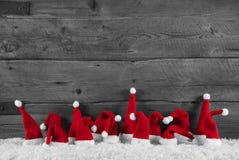 Fond en bois humoristique de rouge, gris et blanc de Noël avec photos stock Fond en bois humoristique de rouge, gris et blanc de Noël avec photos stock