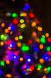 Fond-guirlandes de Noël avec les lumières colorées sur un arbre de Noël décoré, bokeh image libre de droits Fond-guirlandes de Noël avec les lumières colorées sur un arbre de Noël décoré, bokeh image libre de droits