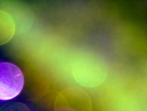 Fond pourpre d'or et effet color? de bokeh photos stock Fond pourpre d'or et effet color? de bokeh photos stock