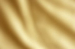 Fondo coprente del raso dell'oro fotografie stock libere da diritti Fondo coprente del raso dell'oro fotografie stock libere da diritti