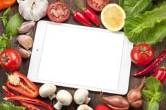 Fondo de la comida de las verduras de la tableta foto de archivo libre de regalías Fondo de la comida de las verduras de la tableta foto de archivo libre de regalías