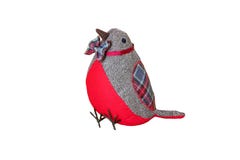 Fondo de la decoración de la Navidad Un pájaro rojo de la tela de la Navidad lleva una corbata de lazo colorida y se aísla en un imagen de archivo libre de regalías Fondo de la decoración de la Navidad Un pájaro rojo de la tela de la Navidad lleva una corbata de lazo colorida y se aísla en un imagen de archivo libre de regalías