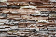 Fondo de la pared de piedra marrón hecha con los bloques fotografía de archivo Fondo de la pared de piedra marrón hecha con los bloques fotografía de archivo