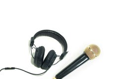 Fones de ouvido com o microfone no fundo do whit fotografia de stock Fones de ouvido com o microfone no fundo do whit fotografia de stock
