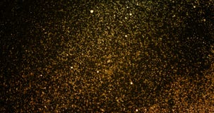 Fonkeling van de Kerstmis schittert de gouden gradiënt de achtergrond van explosiestofdeeltjes met bokeh het stromen neer vallend stock footage Fonkeling van de Kerstmis schittert de gouden gradiënt de achtergrond van explosiestofdeeltjes met bokeh het stromen neer vallend stock footage