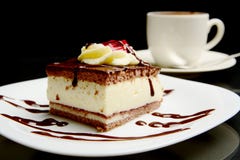 Food of sweet creamy chocolate cake with coffee.