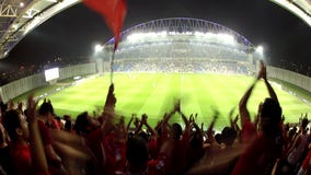 Football sing team anthem stadium. NETANYA, UKRAINE - MAY 08, 2013: Football fans at the Israel - State Cup game between Hapoel Ramat-Gan and Ironi Kiryat shmona Football sing team anthem stadium. NETANYA, UKRAINE - MAY 08, 2013: Football fans at the Israel - State Cup game between Hapoel Ramat-Gan and Ironi Kiryat shmona
