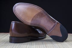 Footwear Concepts and Ideas. Backside View of Penny Loafer Natural Leather Sole royalty free stock image Footwear Concepts and Ideas. Backside View of Penny Loafer Natural Leather Sole royalty free stock image