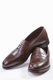 Footwear Concepts. Leather Stylish Brown Penny Loafer Shoes stock image Footwear Concepts. Leather Stylish Brown Penny Loafer Shoes stock image