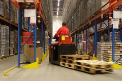 Forkift operator in warehouse. Forkift operator working in warehouse Forkift operator in warehouse. Forkift operator working in warehouse