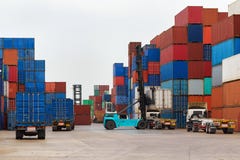 Forklift handling container box loading to truck stock image Forklift handling container box loading to truck stock image