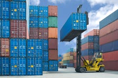 Forklift handling container box loading to truck stock images Forklift handling container box loading to truck stock images