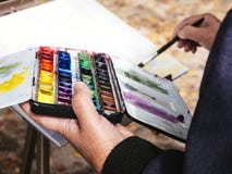 Forma de vida del ocio de la gente de los watercolours de la pintura del artista al aire libre imagenes de archivo Forma de vida del ocio de la gente de los watercolours de la pintura del artista al aire libre imagenes de archivo