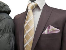 Formal suit and an common winter coat on an exhibition isolated on white. stock photography Formal suit and an common winter coat on an exhibition isolated on white. stock photography