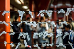 Fortune papers tied to ropes at Japanese shrine stock images Fortune papers tied to ropes at Japanese shrine stock images