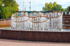 Fountain in the form of Olympic symbols, 5 intertwined Olympic rings royalty free stock photos Fountain in the form of Olympic symbols, 5 intertwined Olympic rings royalty free stock photos