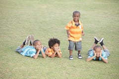 Four brothers. Four African American brothers enjoying the day at the park stock photography Four brothers. Four African American brothers enjoying the day at the park stock photography