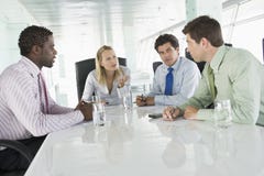 Four Businesspeople Having Meeting
