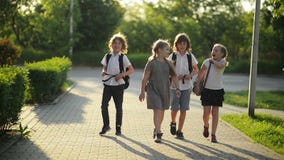 Four Friends Are Going to School. They Have A Lot of Fun Because Today is Their First Day at School.