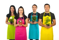 Four Gardeners Workers Offering Flowers Stock Images Four Gardeners Workers Offering Flowers Stock Images
